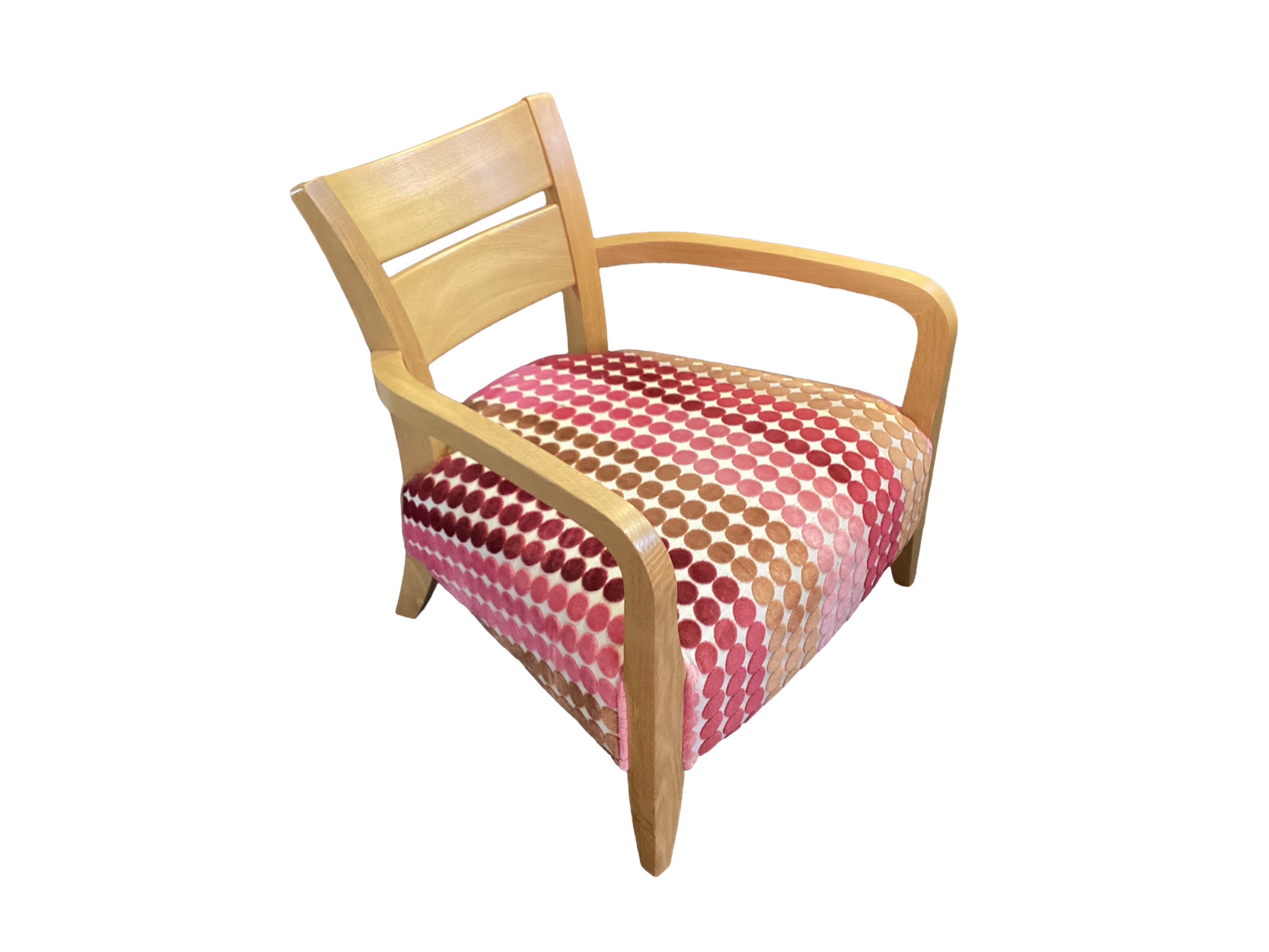 A Contemporary light oak upholstered armchair, width 70cm, depth 68cm, height 69cm